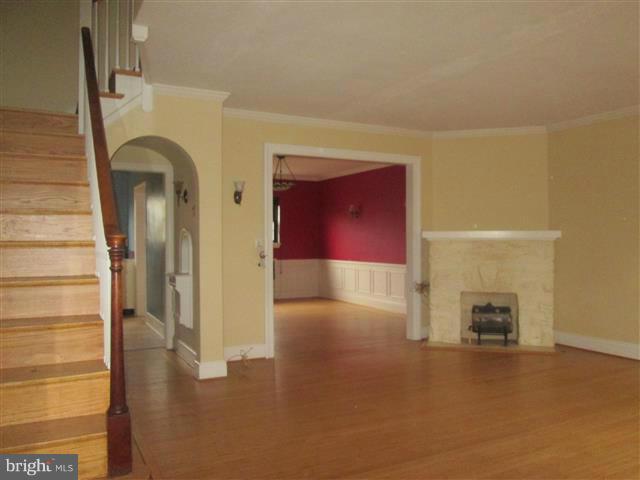 3711 Rexmere Road Baltimore, MD 21218 - Photo 3 of 23 a view of livingroom with furniture and a fireplace