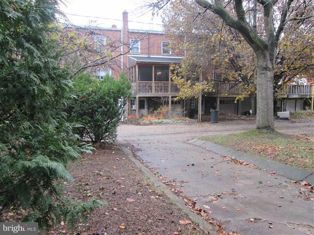 3711 Rexmere Road Baltimore, MD 21218 - Photo 23 of 23 a front view of a house with a garden