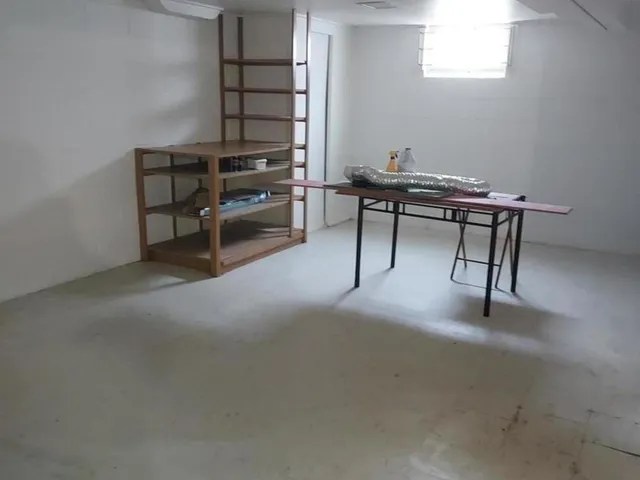 a view of a workspace with furniture