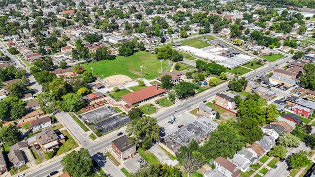 an aerial view of residential houses with outdoor space