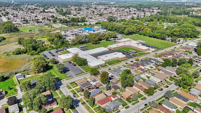 an aerial view of residential houses with outdoor space