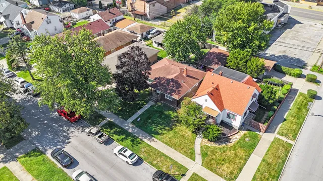 an aerial view of residential house with outdoor space