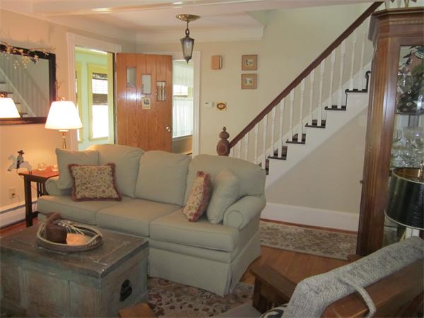 19 Putnam Road Ipswich, MA 01938 - Photo 3 of 13 a living room with furniture and a dining table