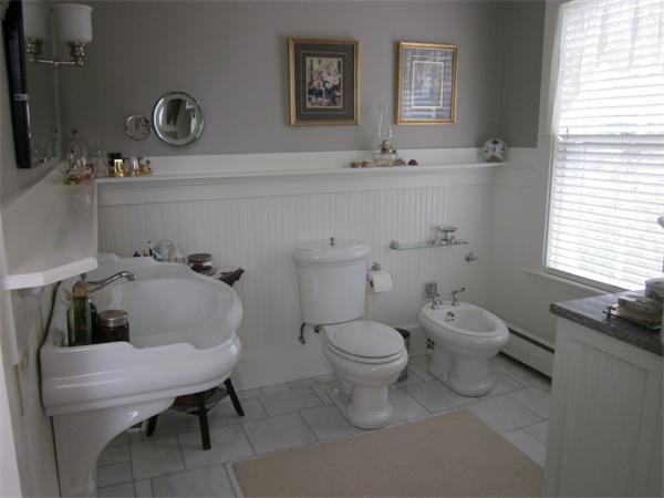 19 Putnam Road Ipswich, MA 01938 - Photo 6 of 13 a bathroom with a toilet sink and mirror