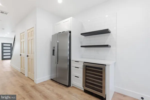 a view of an empty room with a fireplace