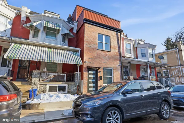 a view of a car parked in front of a building