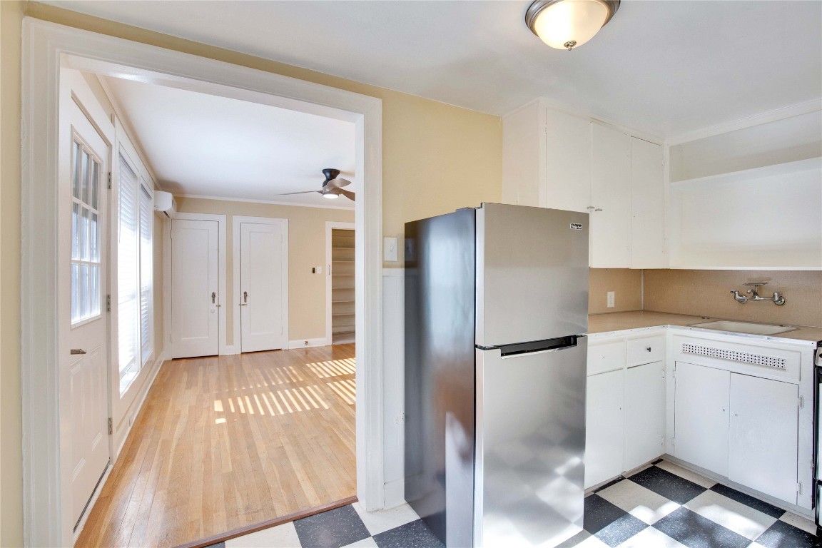 1115 Enfield Road, Unit C Austin, TX 78703 - Photo 16 of 26 a kitchen with a refrigerator and a sink