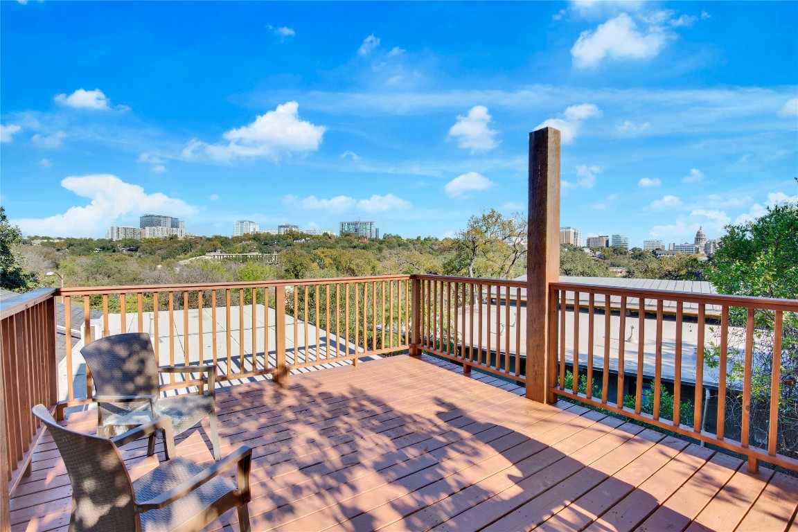 1115 Enfield Road, Unit C Austin, TX 78703 - Photo 25 of 26 a view of a balcony with wooden floor