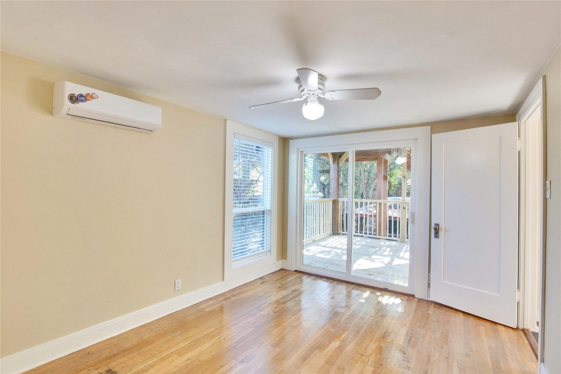 1115 Enfield Road, Unit C Austin, TX 78703 - Photo 8 of 26 a view of empty room with wooden floor and fan
