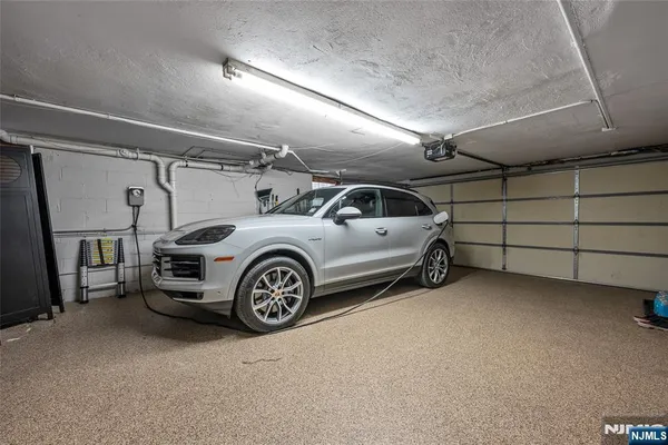 a view of garage with cars