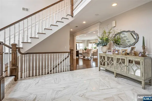 a view of entryway with wooden floor