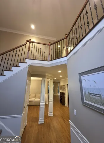 a view of staircase with white walls and a window