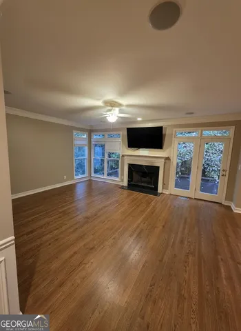 an empty room with furniture and a fireplace
