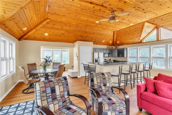 a view of a dining room with furniture wooden floor and a chandelier