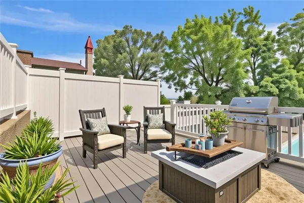 a view of a house with wooden deck