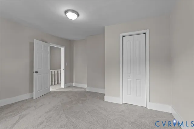 an empty room with closet area