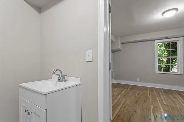 a bathroom with a sink toilet and vanity