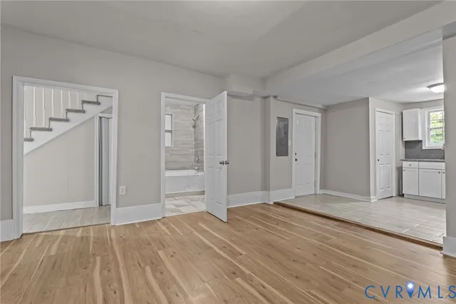 wooden floor with white walls