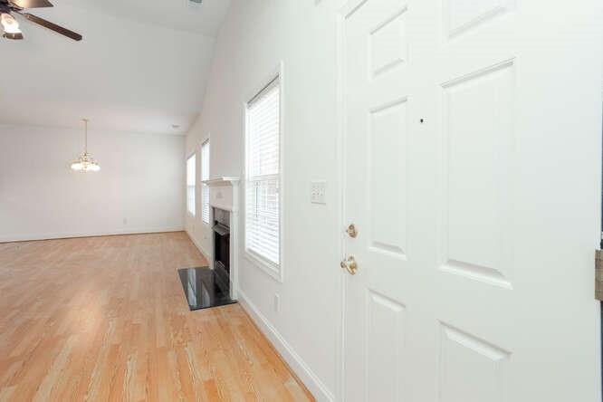 3402 Raes Creek Road, Unit 27 Marietta, GA 30008 - Photo 11 of 32 a view of a room with wooden floor and windows