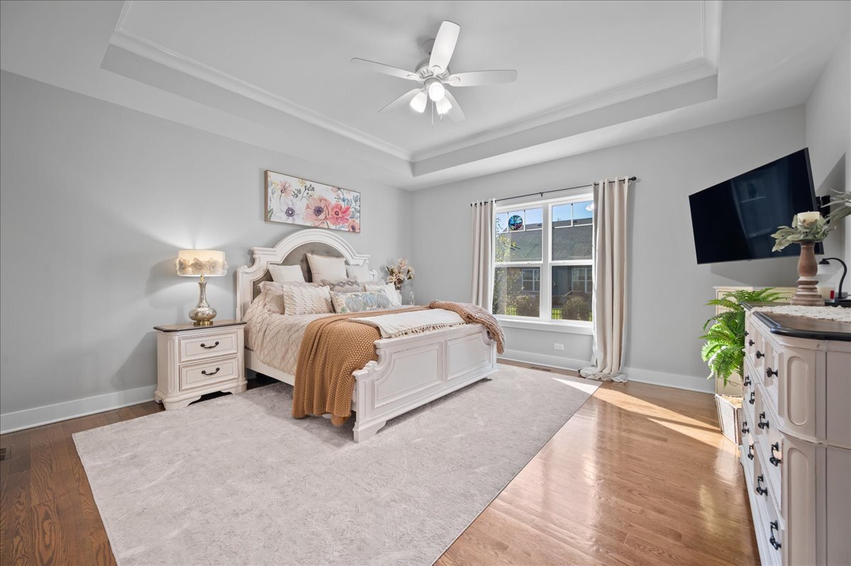 1383 Dodson Avenue Elburn, IL 60119 - Photo 12 of 25 a spacious bedroom with a bed and a flat screen tv