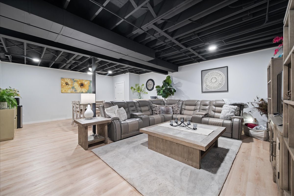 1383 Dodson Avenue Elburn, IL 60119 - Photo 21 of 25 a living room with furniture and a flat screen tv