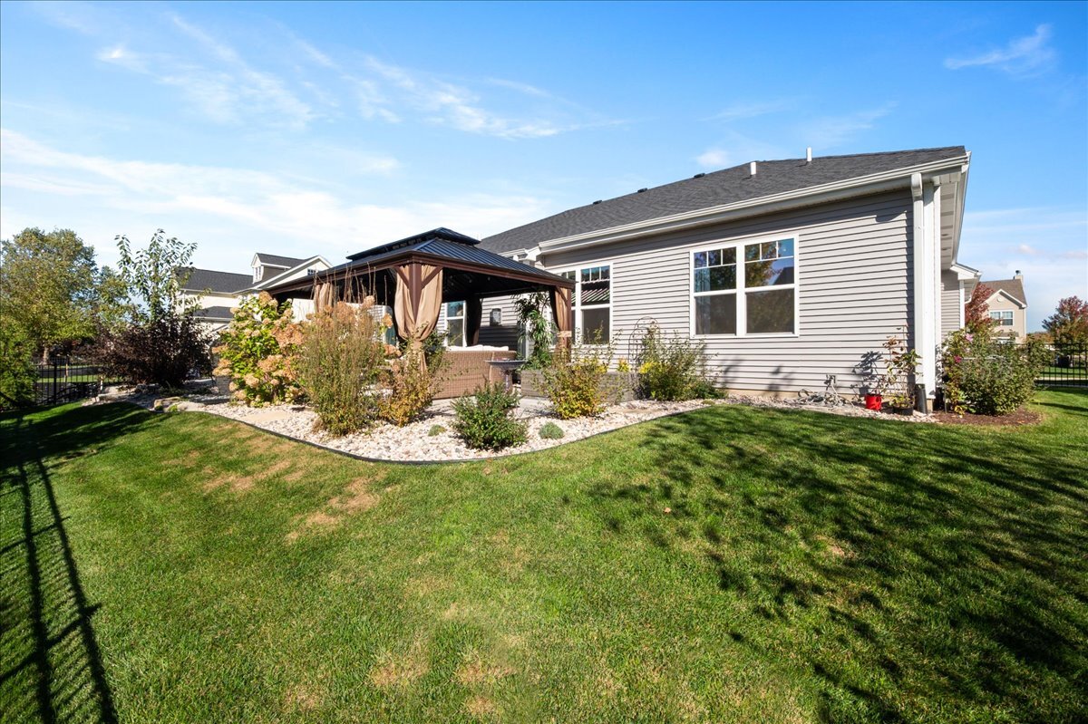 1383 Dodson Avenue Elburn, IL 60119 - Photo 24 of 25 a view of a house with a backyard