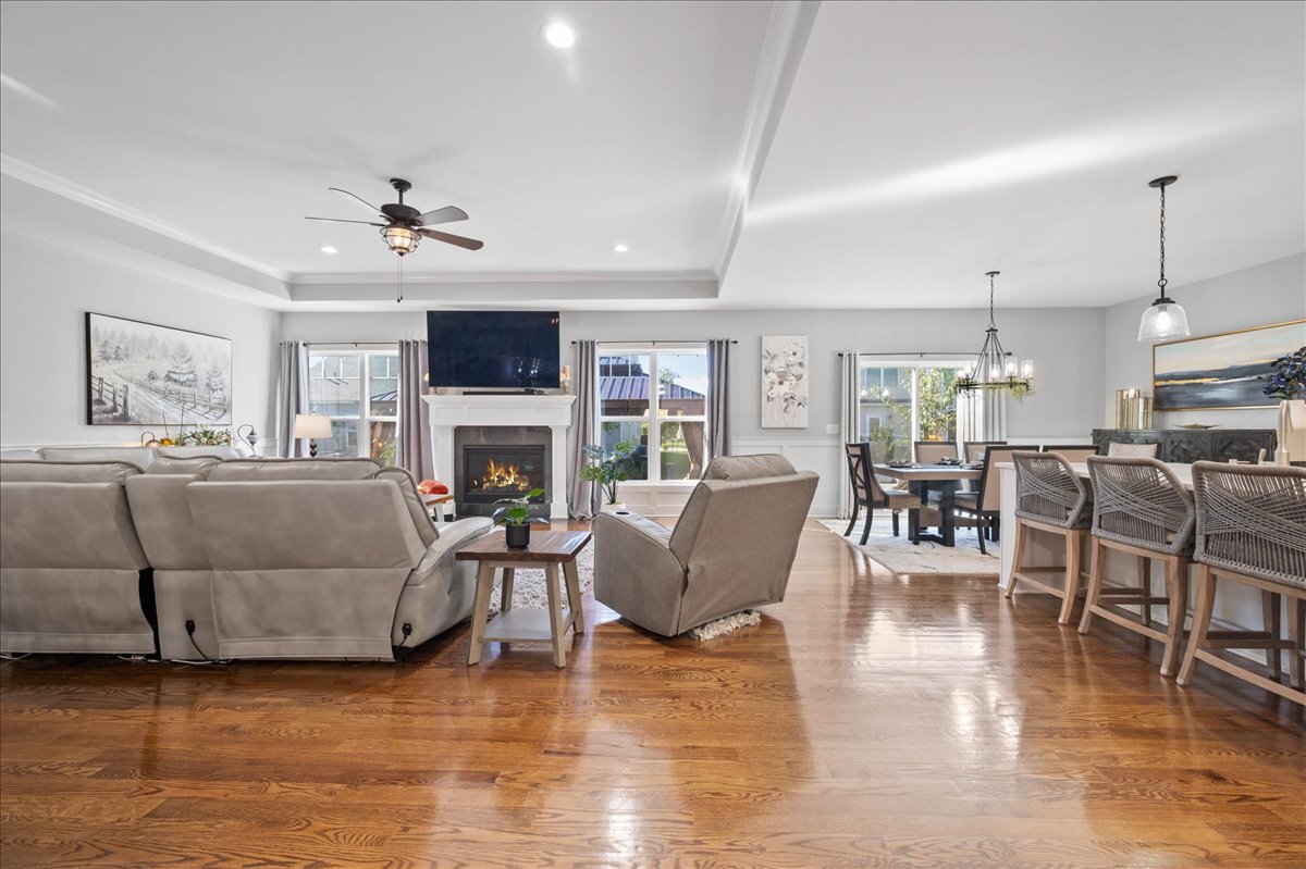 1383 Dodson Avenue Elburn, IL 60119 - Photo 5 of 25 a living room with furniture a fireplace and a flat screen tv