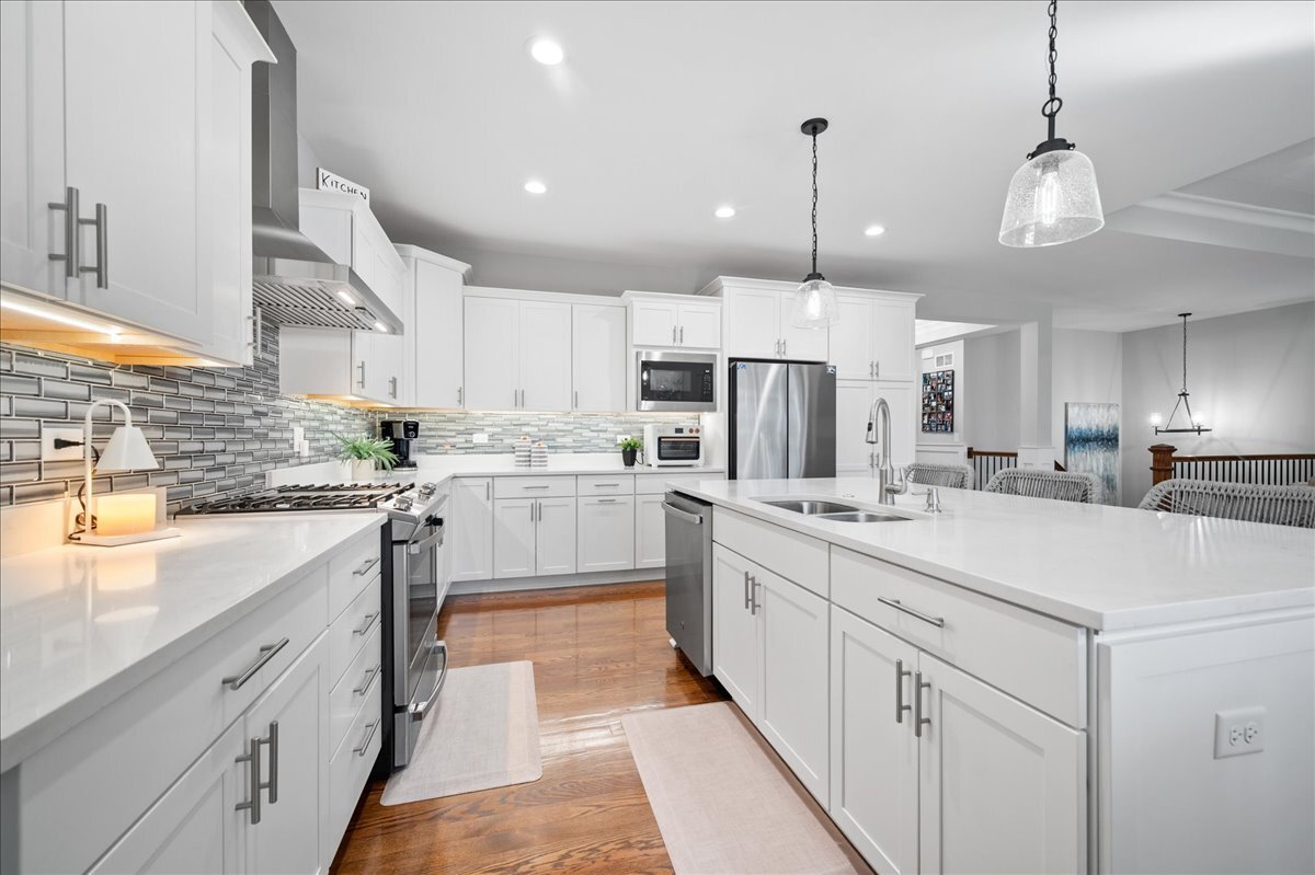 1383 Dodson Avenue Elburn, IL 60119 - Photo 8 of 25 a kitchen with kitchen island granite countertop appliances cabinets and a sink