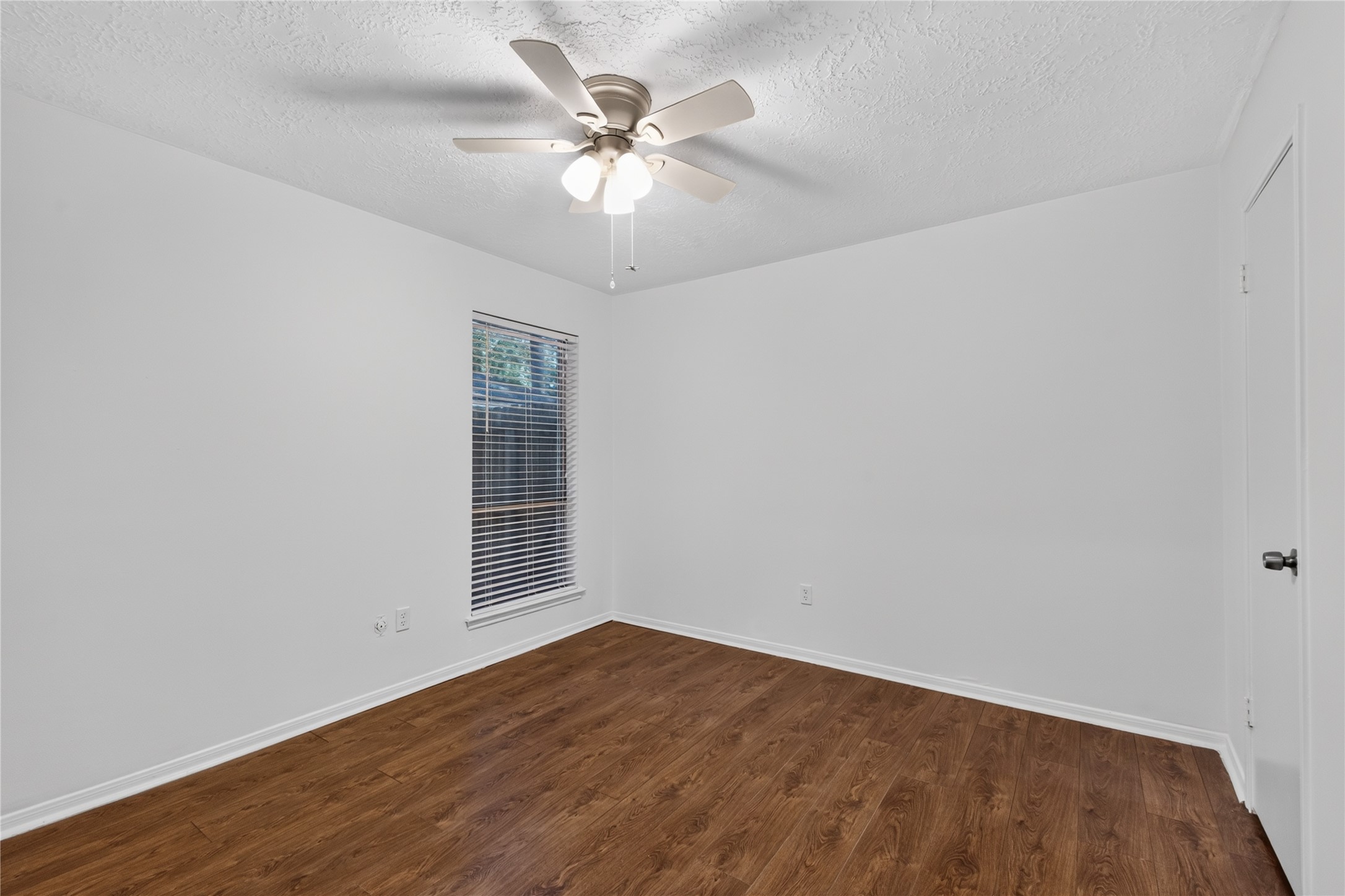 25223 Lynbriar Lane Spring, TX 77373 - Photo 17 of 32 Another comfortable bedroom with natural light, a ceiling fan, a walk-in closet and easy access to the nearby full bathroom