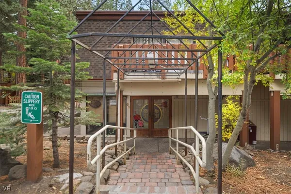 a view of a chairs and table in patio