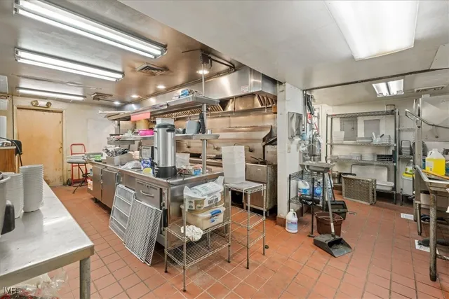 a storage room with lots of white furniture