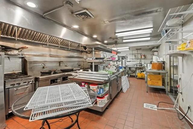 a stove top oven sitting inside of a kitchen