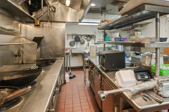 a kitchen with table and chairs