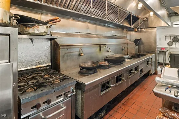 a kitchen with counter top space and breakfast area