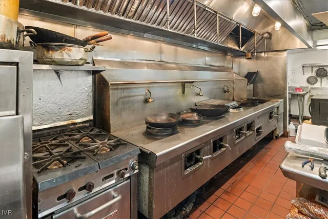 a kitchen with counter top space and breakfast area