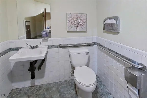 a kitchen with stainless steel appliances granite countertop a refrigerator and a stove