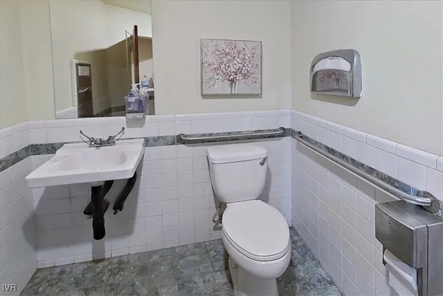 a kitchen with stainless steel appliances granite countertop a refrigerator and a stove