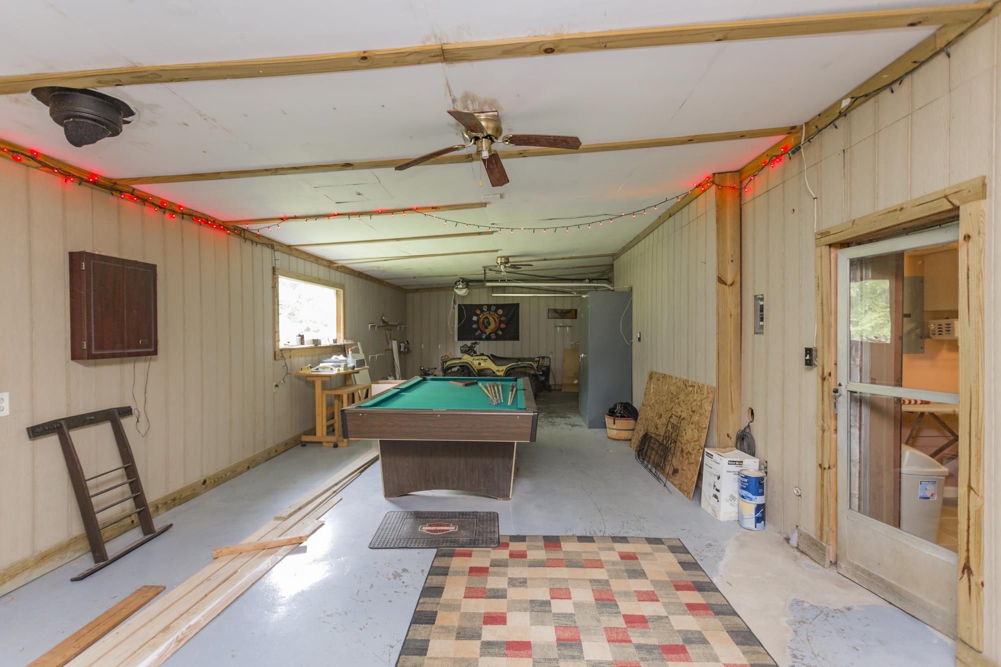 785 Danley Road Charlotte, TN 37036 - Photo 21 of 30 This area has a small garage door, perfect for hobby equipment or small engines.