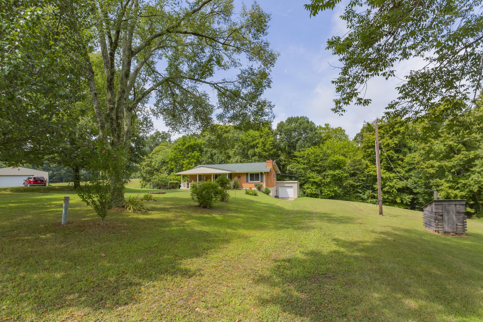 785 Danley Road Charlotte, TN 37036 - Photo 4 of 30 Mature trees and woods keep you private in this lovely part of Tennessee.