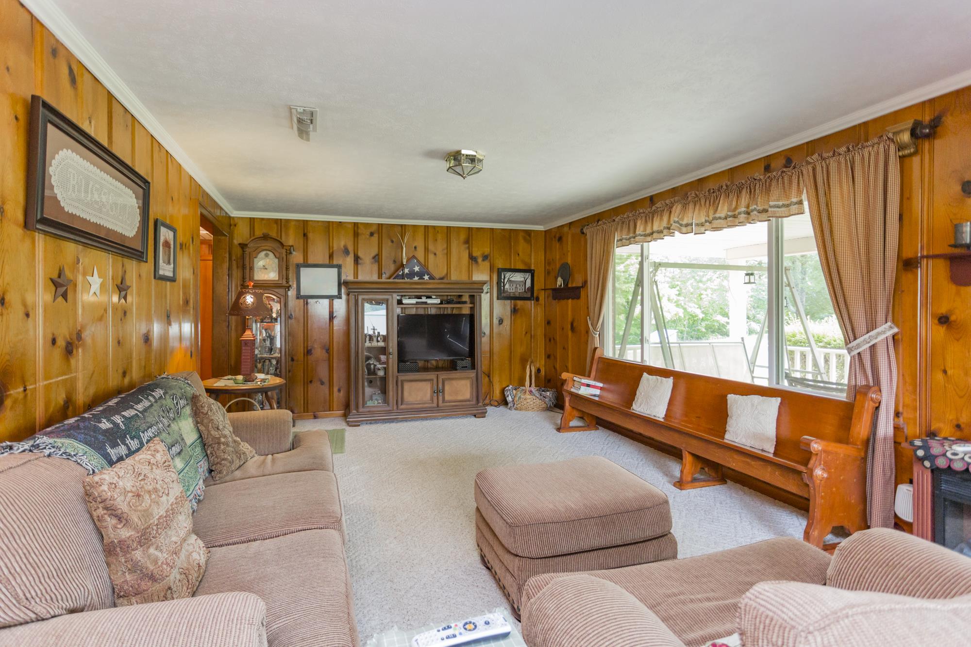 785 Danley Road Charlotte, TN 37036 - Photo 6 of 30 Large, warm living room with natural light and space for large furniture.