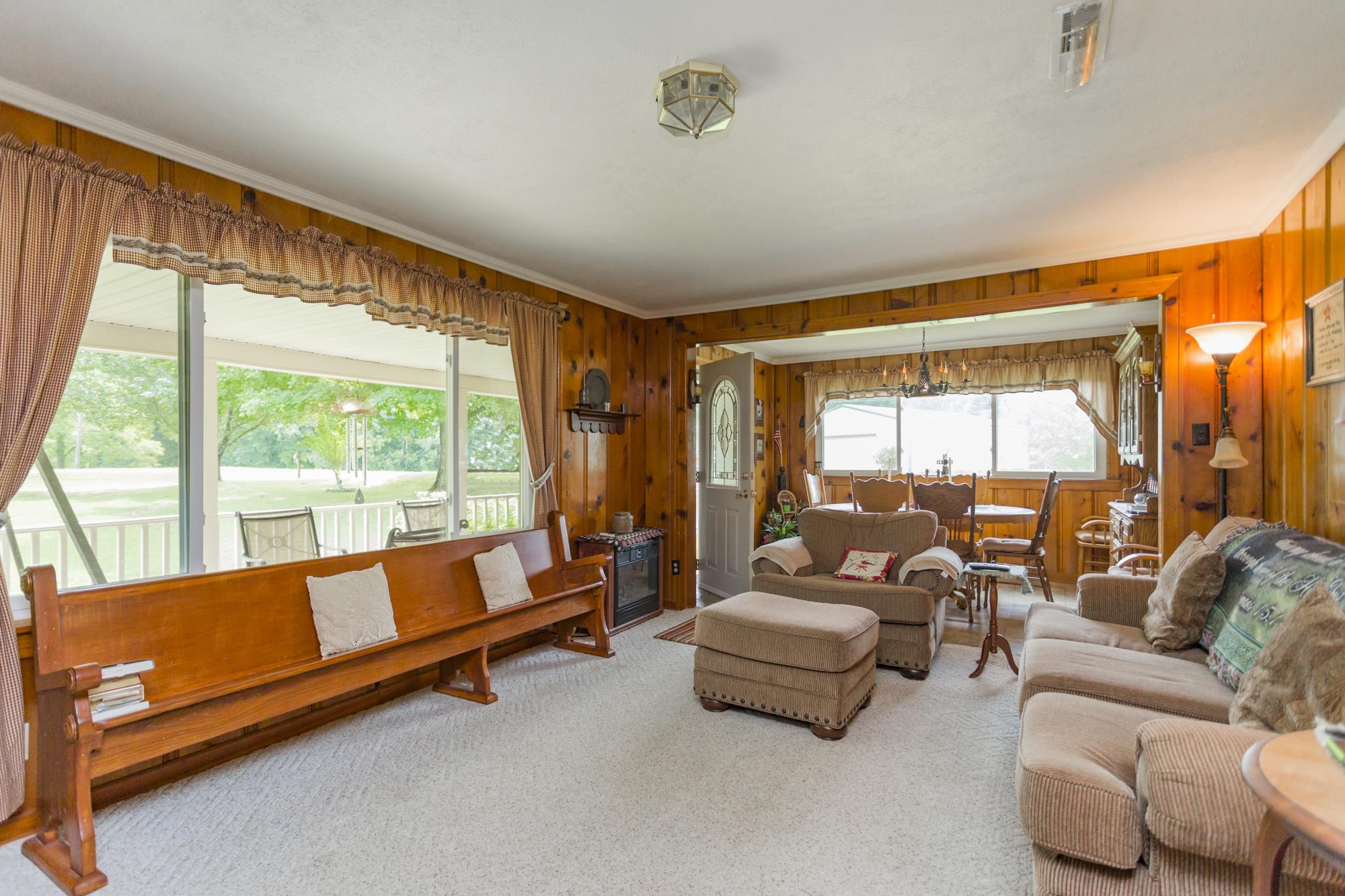 785 Danley Road Charlotte, TN 37036 - Photo 7 of 30 Clean carpeted floors will keep you comfortable in this immaculately kept home.