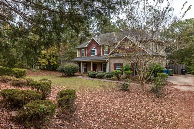 a front view of a house with garden