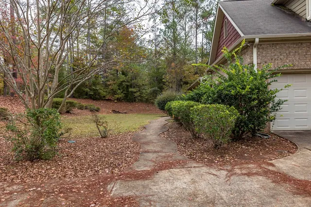 a backyard of a house with lots of green space