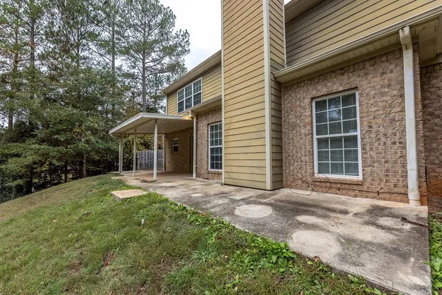 a front view of a house with a yard and porch