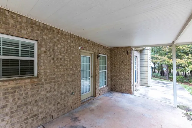 a view of outdoor space with balcony and trees