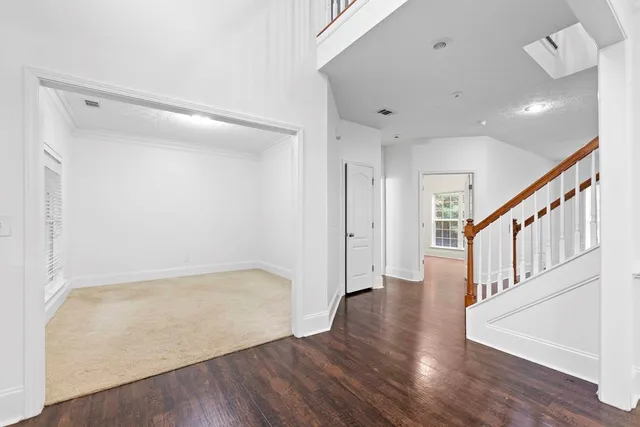 a view of an entryway with wooden floor