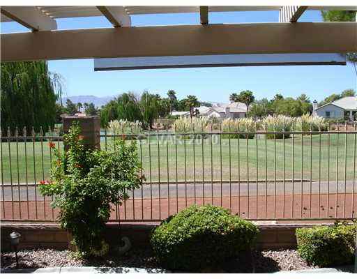 5205 Rim View Lane Las Vegas, NV 89130 - Photo 2 of 25 View. This is a view of the golf course & lake from the backyard.