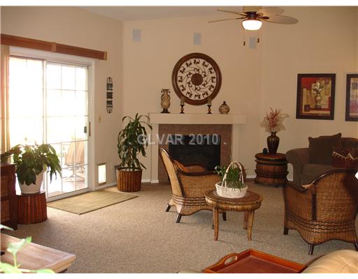 5205 Rim View Lane Las Vegas, NV 89130 - Photo 4 of 25 Den. The right side of the Great Room has a gas fireplace and patio doors to the covered patio.