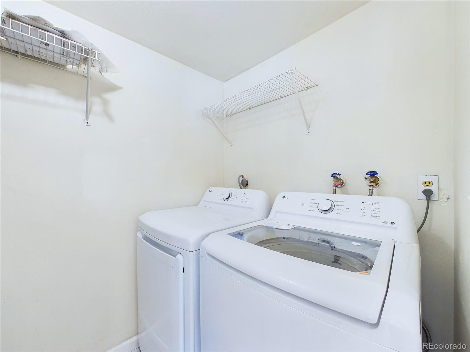 8770 Rainbow Avenue, Unit B4 Denver, CO 80229 - Photo 11 of 29 a utility room with dryer and washer