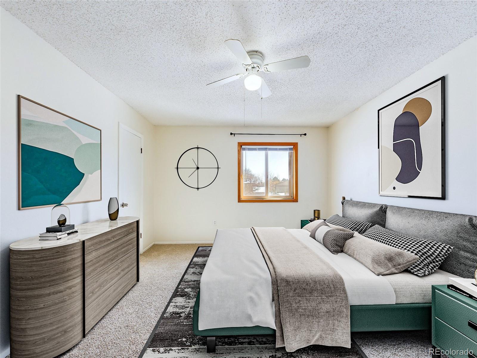 8770 Rainbow Avenue, Unit B4 Denver, CO 80229 - Photo 19 of 29 a bedroom with a large bed and a window